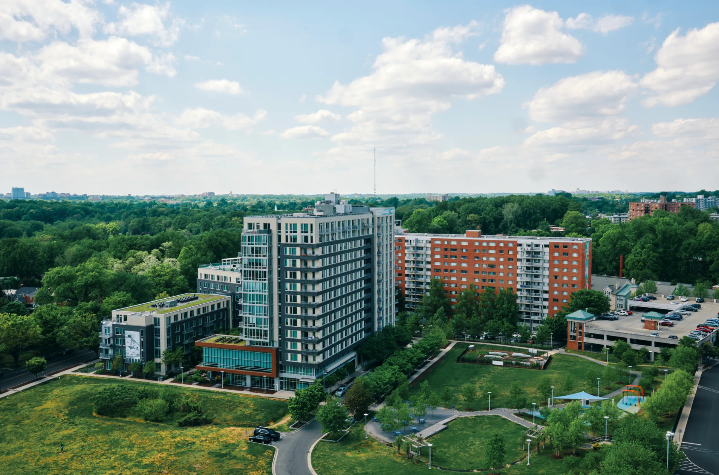 exterior of The Blairs with a tree-lined street and surrounded by green space