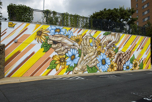 mural of hands and flowers at The Blairs