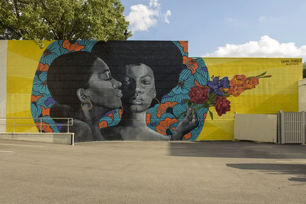 mural of two black women and flowers at The Blairs