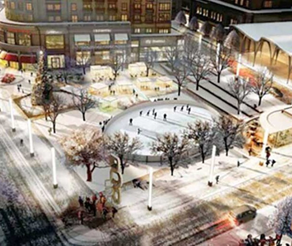 aerial view of people at a skating rink and surrounding park covered in snow
