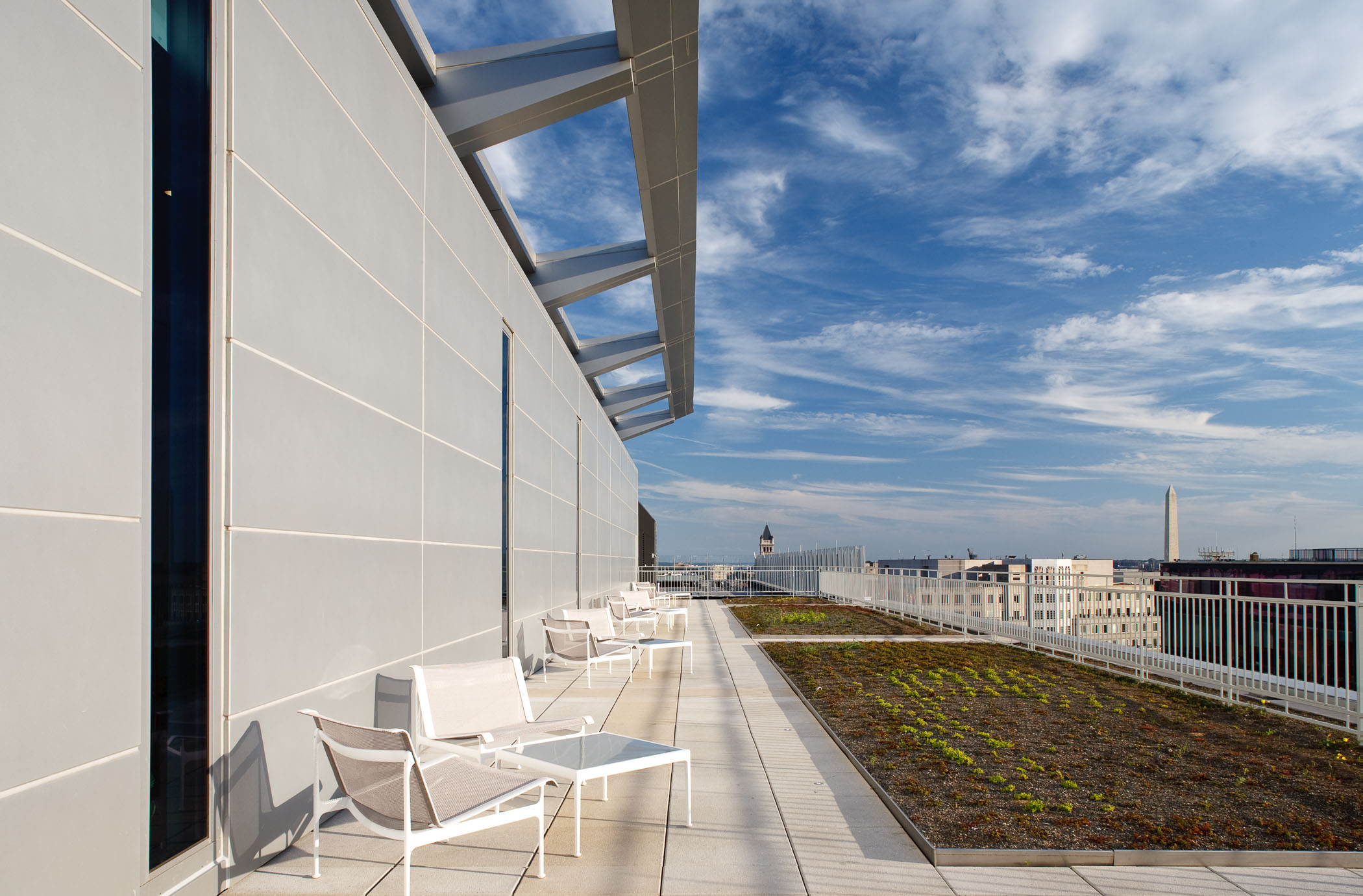 rooftop terrace with seating areas and garden beds
