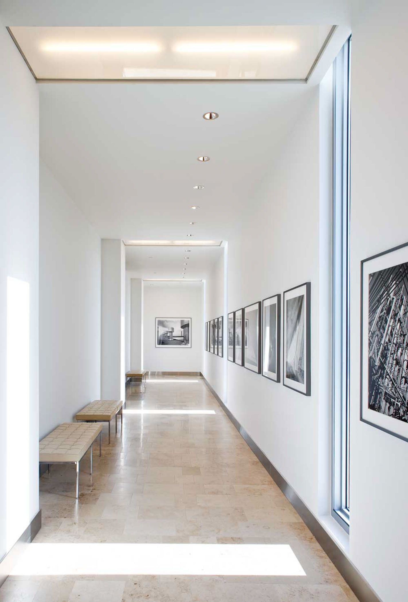 benches and framed artwork along a hallway
