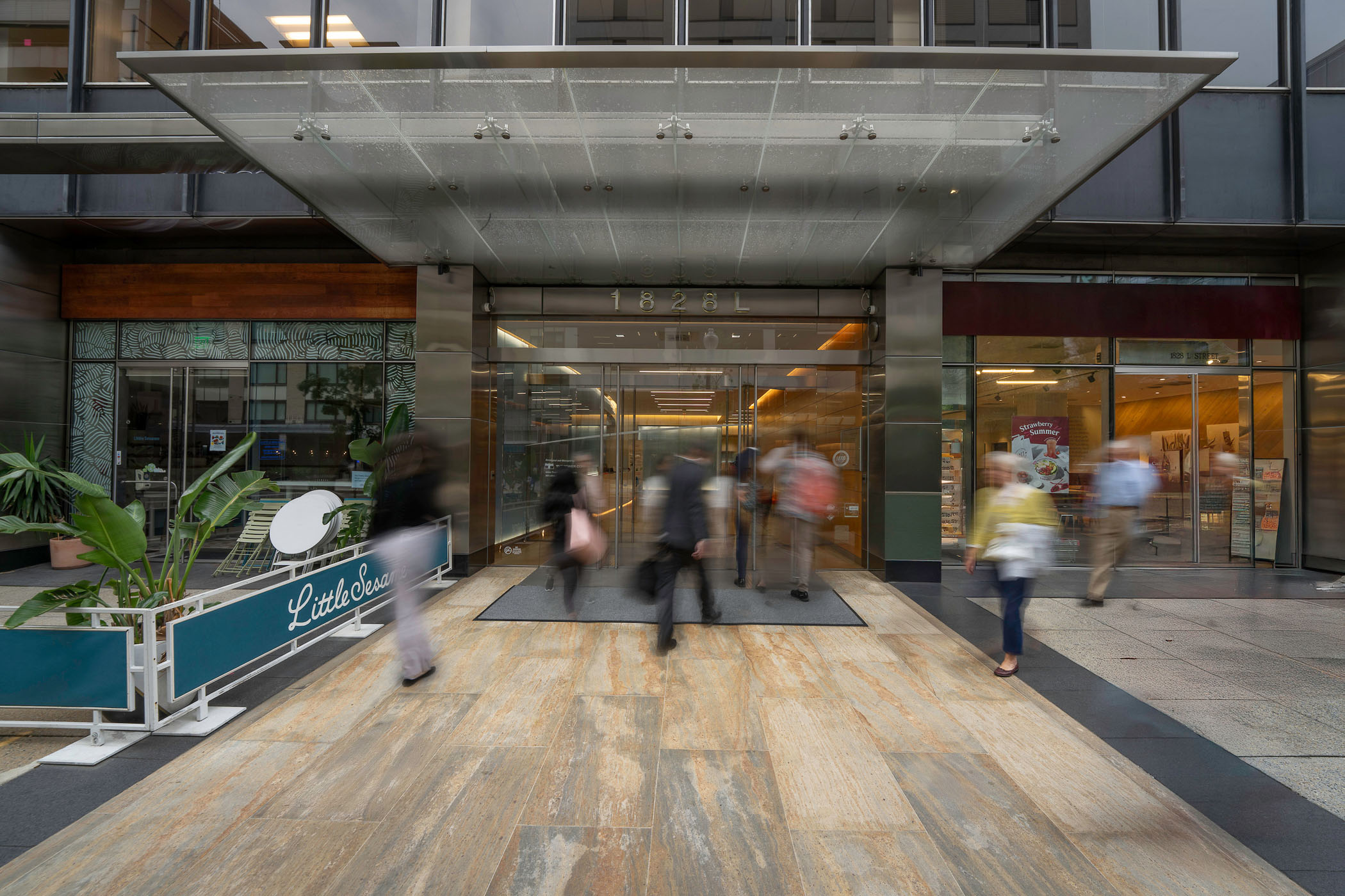 people at the entrance of 1828 L Street NW in Washington, DC