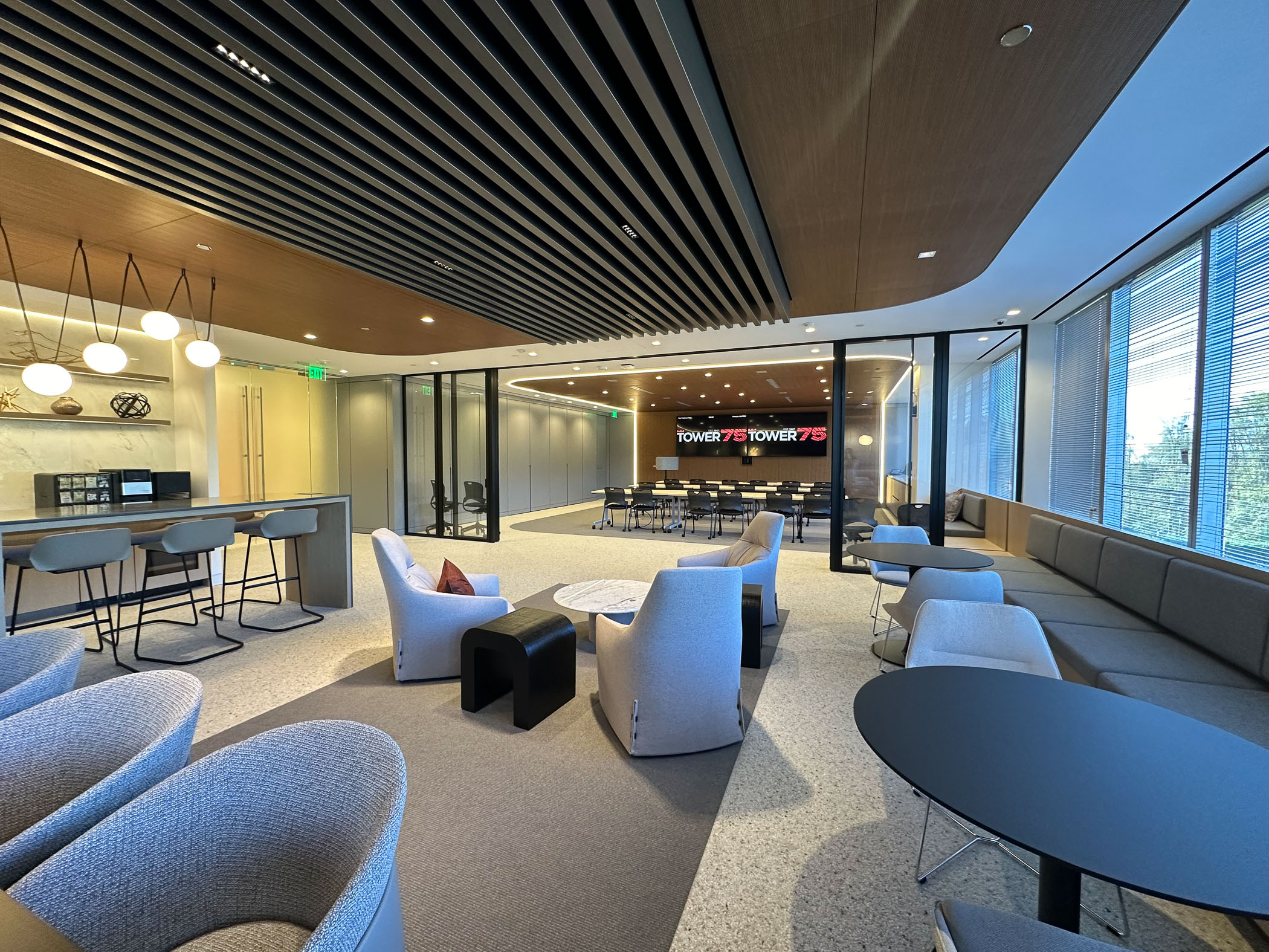 lounge area with seating outside of a meeting room at 2000 Tower Oaks