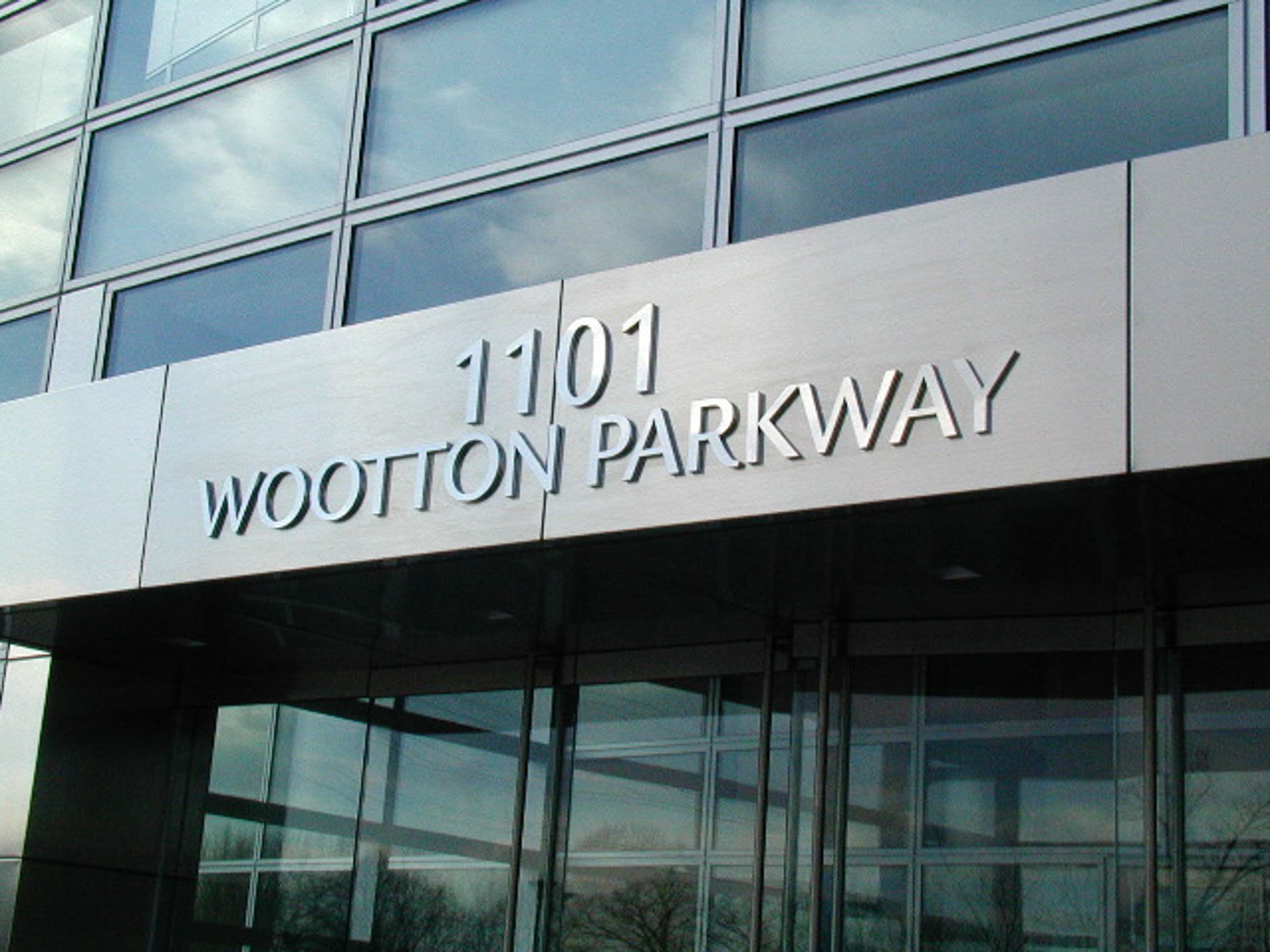 close up of 1101 Wootton Parkway signage above entrance of The Tower Building