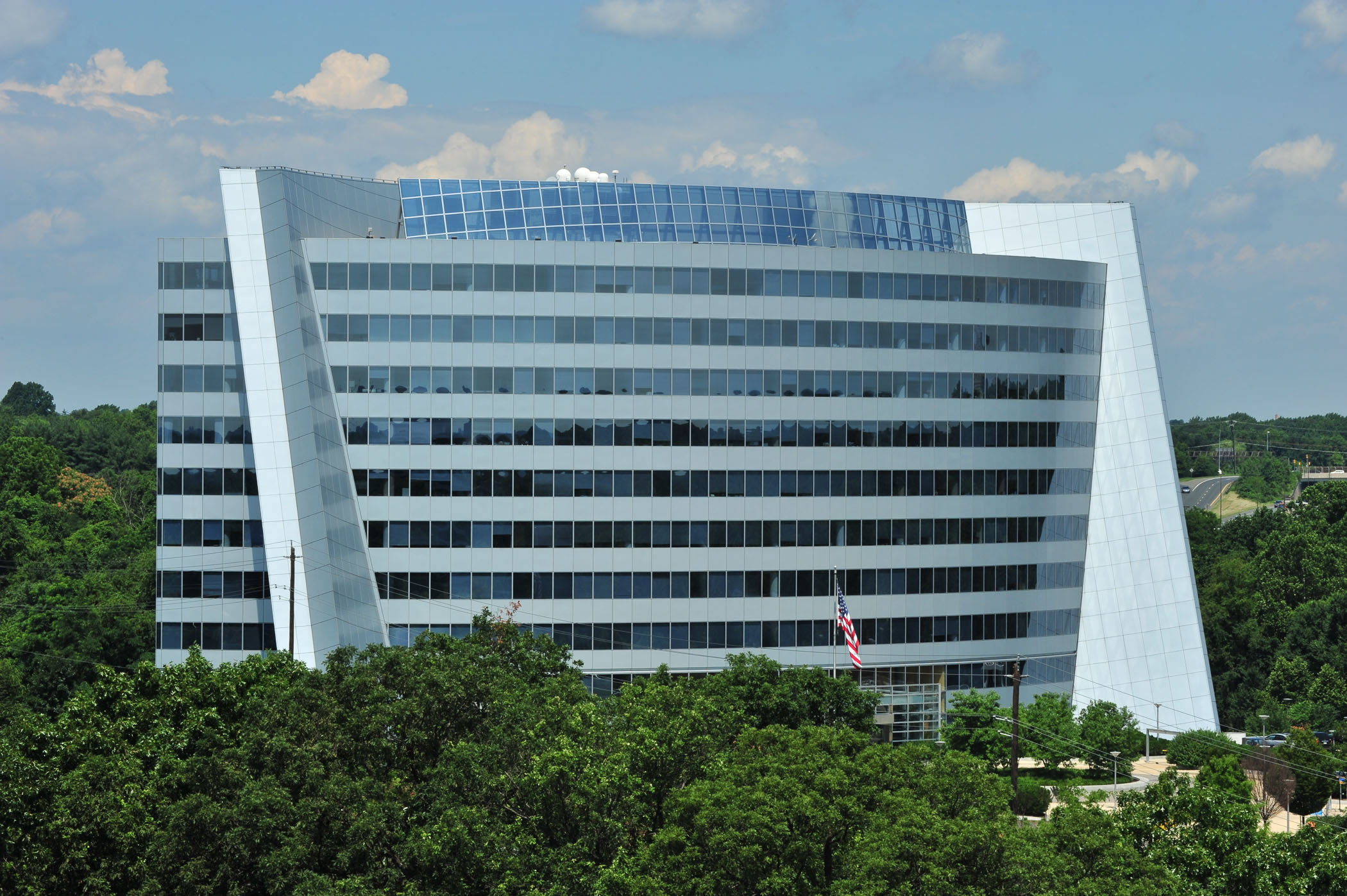 The Tower Building surrounded by green trees