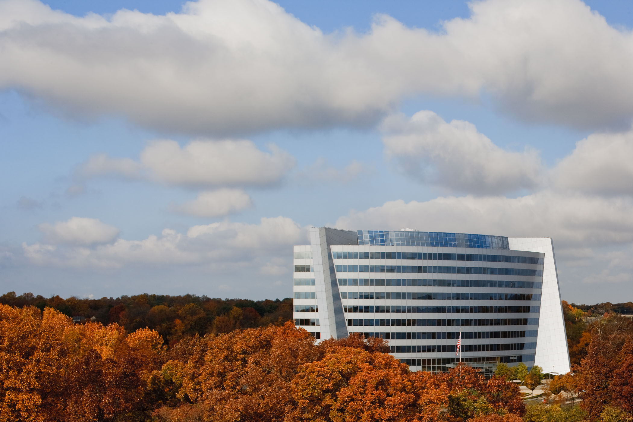 exterior view of an office building surrounded by fall trees